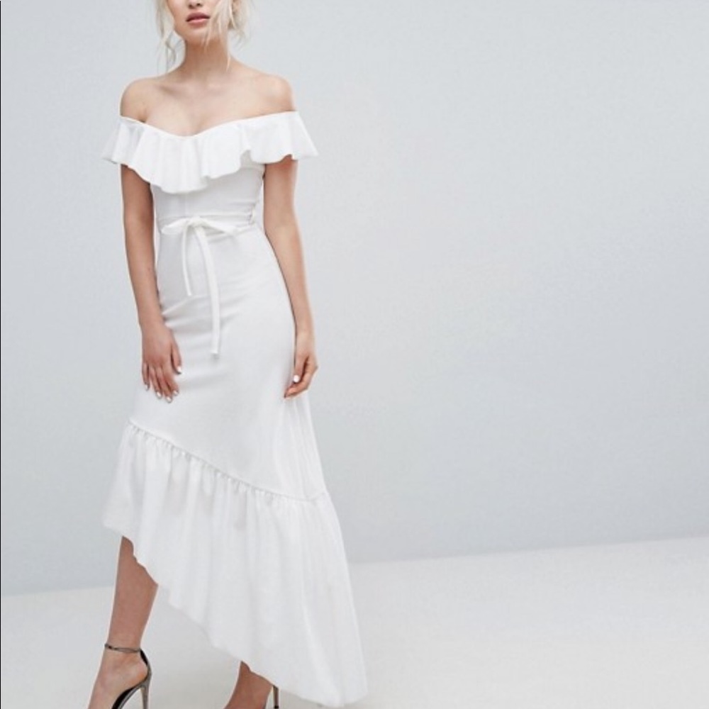 Club London frill dress with asymmetrical hem.